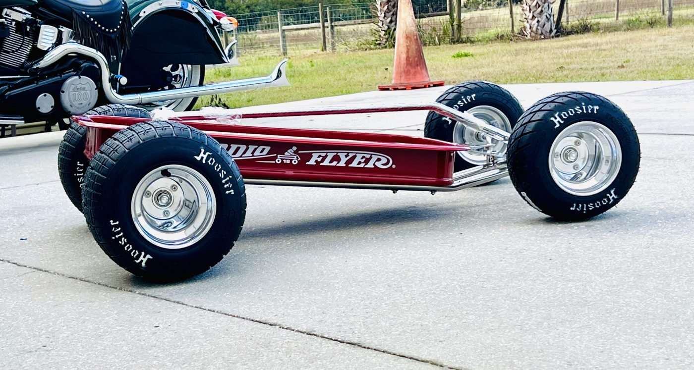 DKCC Hot Rod Flyer — front three-quarter view showing chrome steering linkage and Hoosier front tires