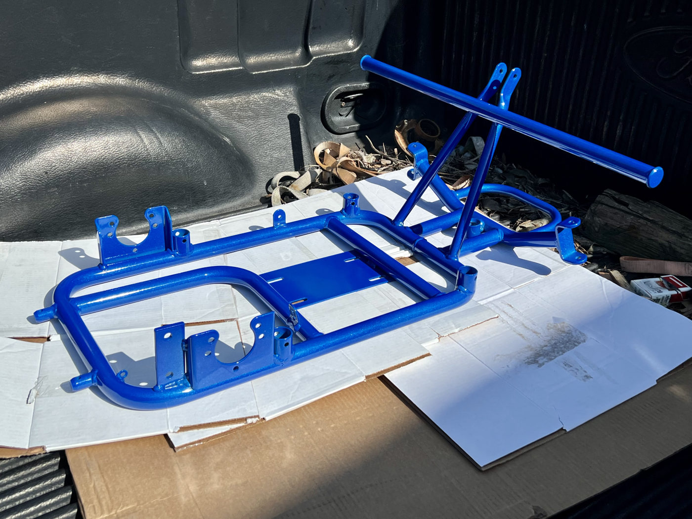 DKCC Bar-Hag — freshly powder-coated blue chromoly frame laid out before assembly