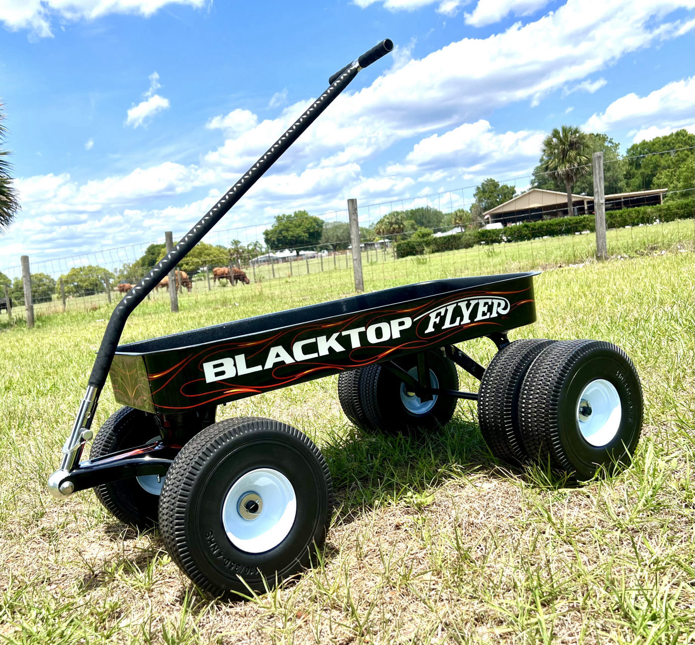 DKCC Blacktop Flyer — full side profile showing Blacktop Flyer graphics and dually rear wheels in field