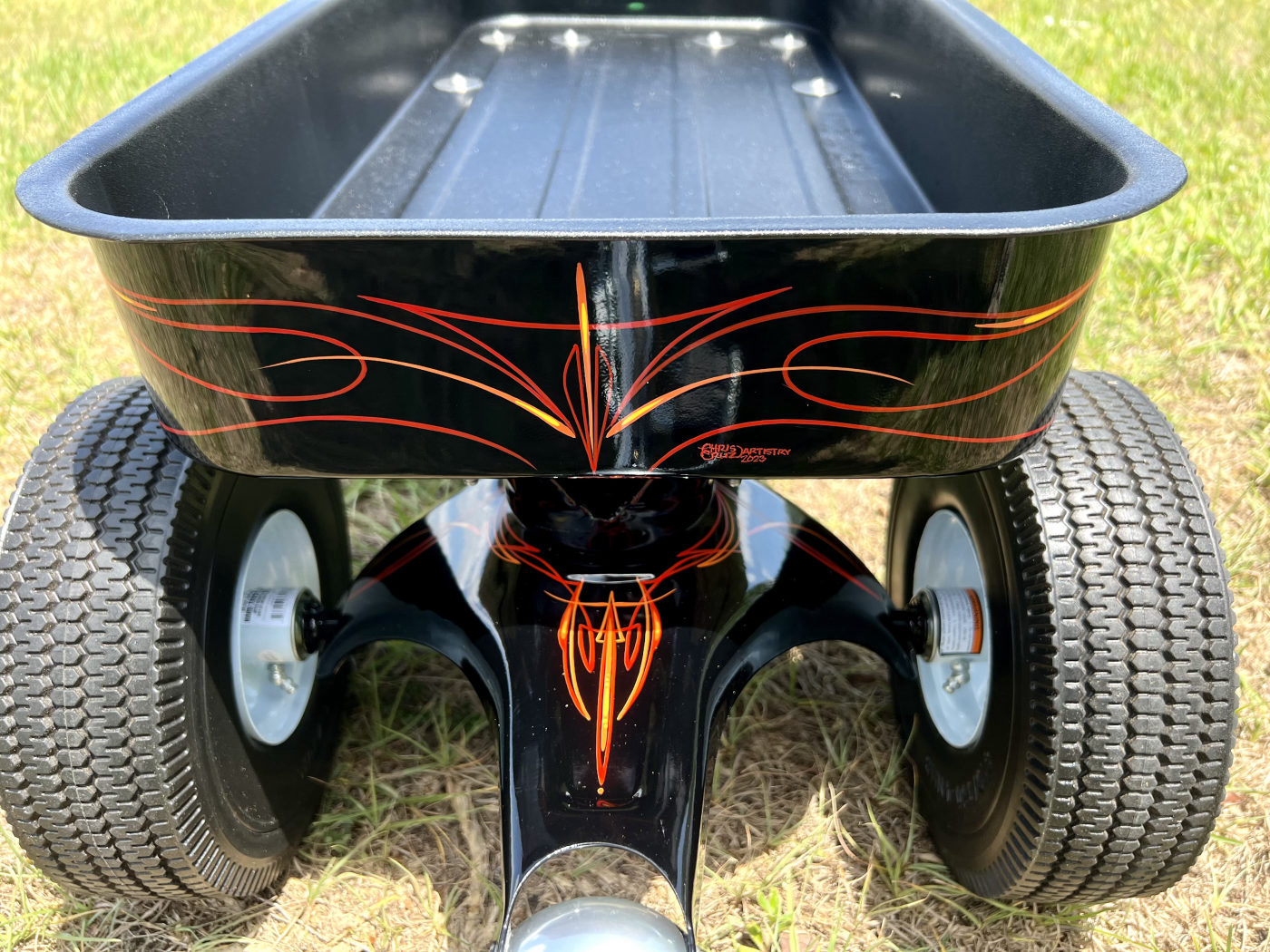 DKCC Blacktop Flyer — rear close-up showing pinstripe flame detail and Chris Bules Artistry signature