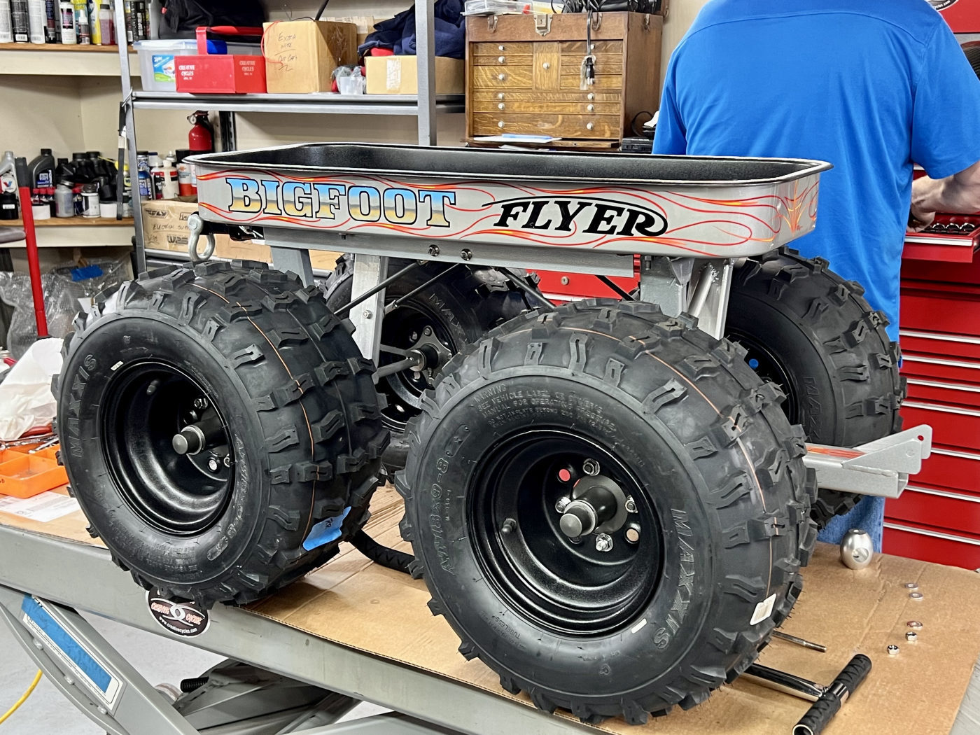 DKCC Bigfoot Flyer — shop build shot showing monster truck tires and custom chassis