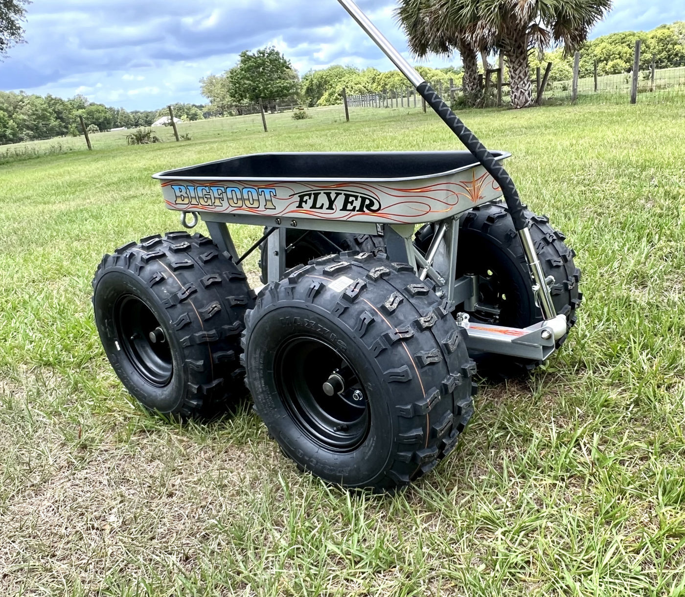 DKCC Bigfoot Flyer — three-quarter view showing full build in field setting