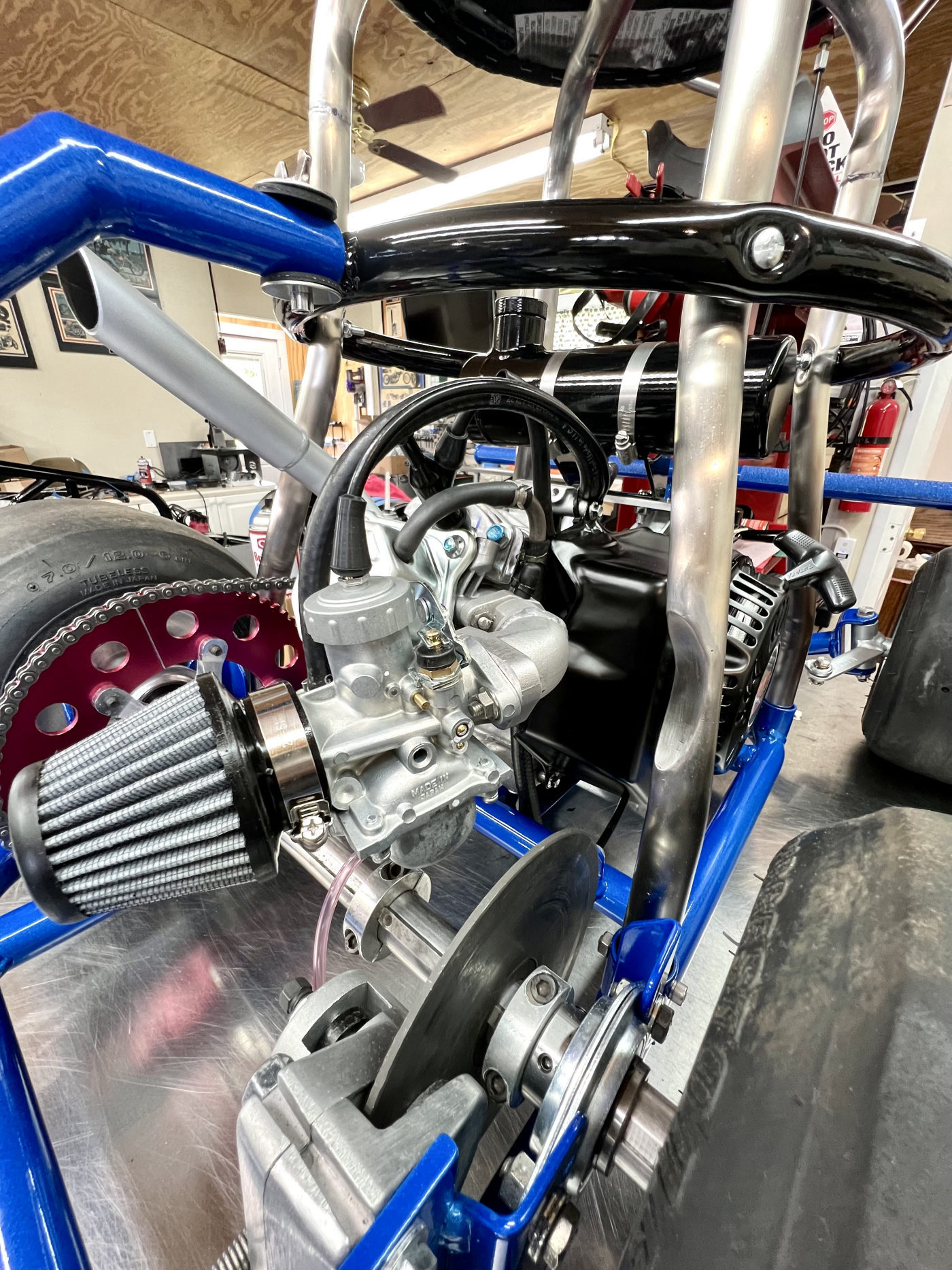 DKCC Bar-Hag — engine bay detail showing OHV engine, high-flow air filter and red anodized sprocket
