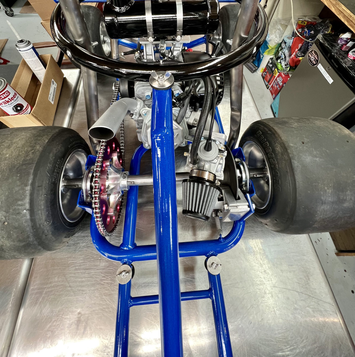 DKCC Bar-Hag — completed build three-quarter view outdoors showing blue chromoly frame and bar stool seat